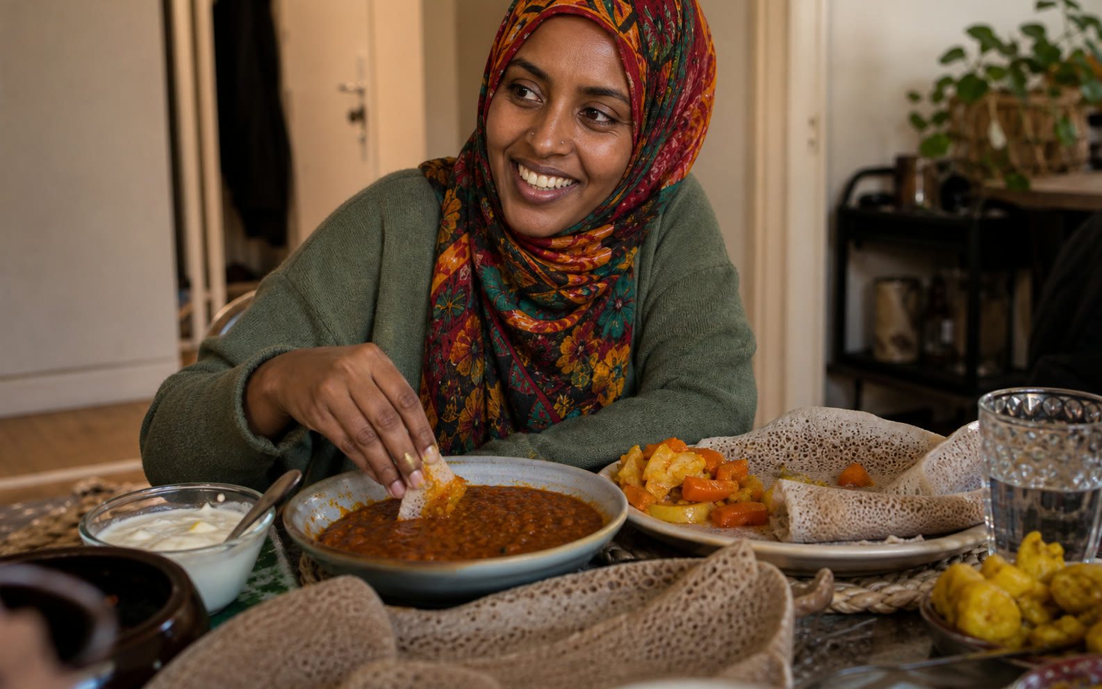 A client enjoying a home-cooked meal that follows her care plan.